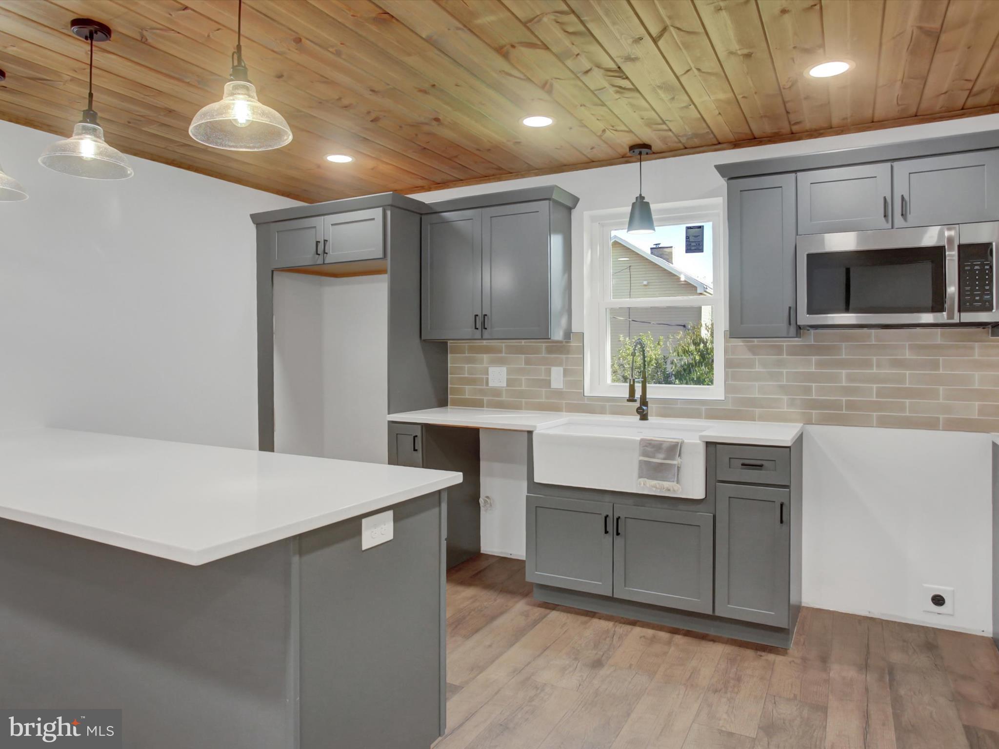 16 East Main Street Newburg, PA 17240 - Photo 15 of 48 a kitchen with kitchen island a sink stainless steel appliances and cabinets