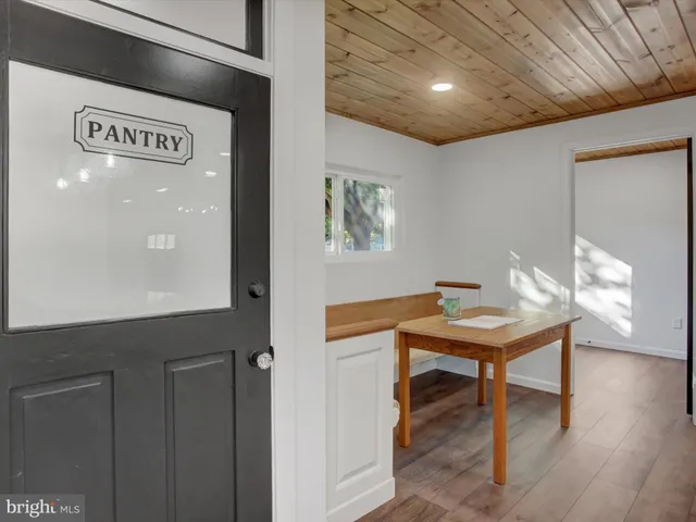 a view of a hallway with furniture