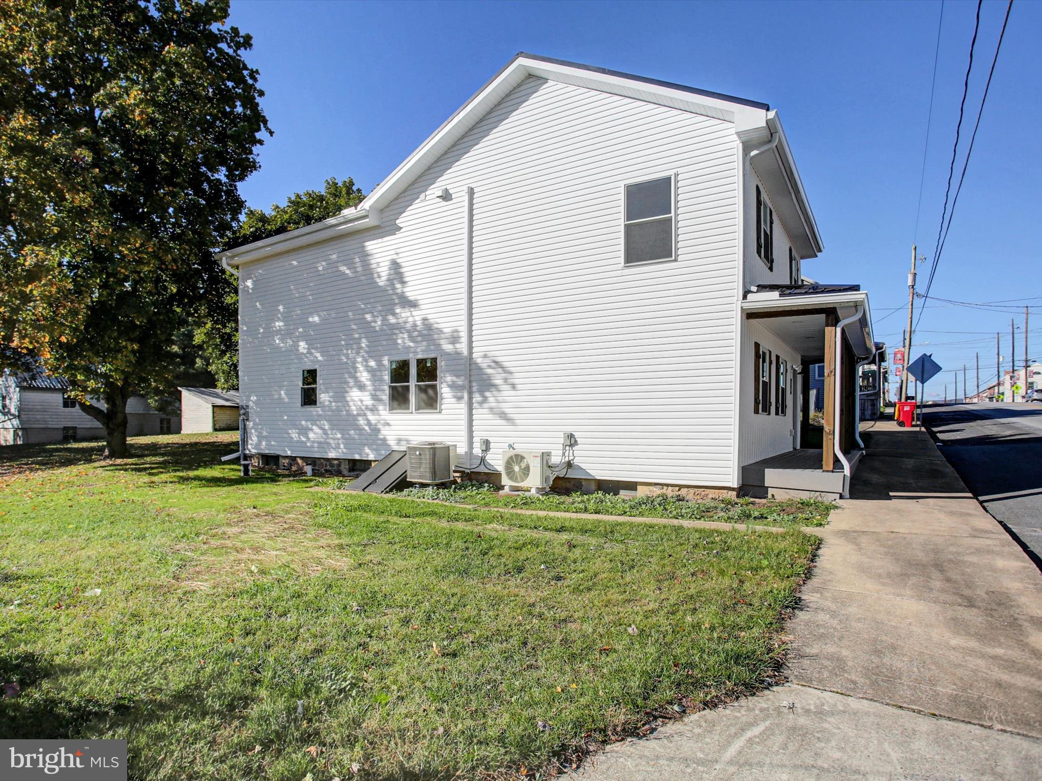 16 East Main Street Newburg, PA 17240 - Photo 4 of 48 a front view of a house with a yard