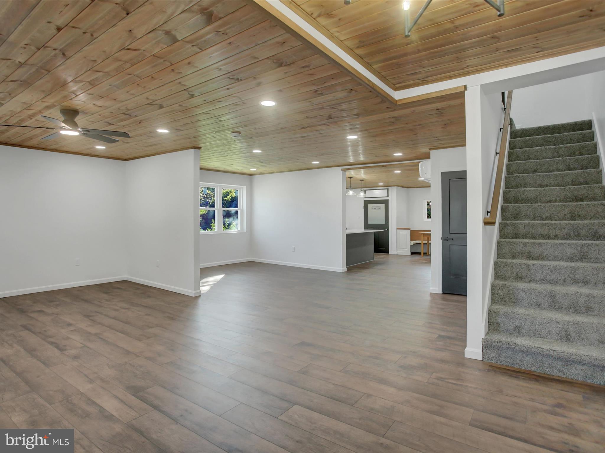 16 East Main Street Newburg, PA 17240 - Photo 7 of 48 a view of a livingroom with wooden floor and stairs