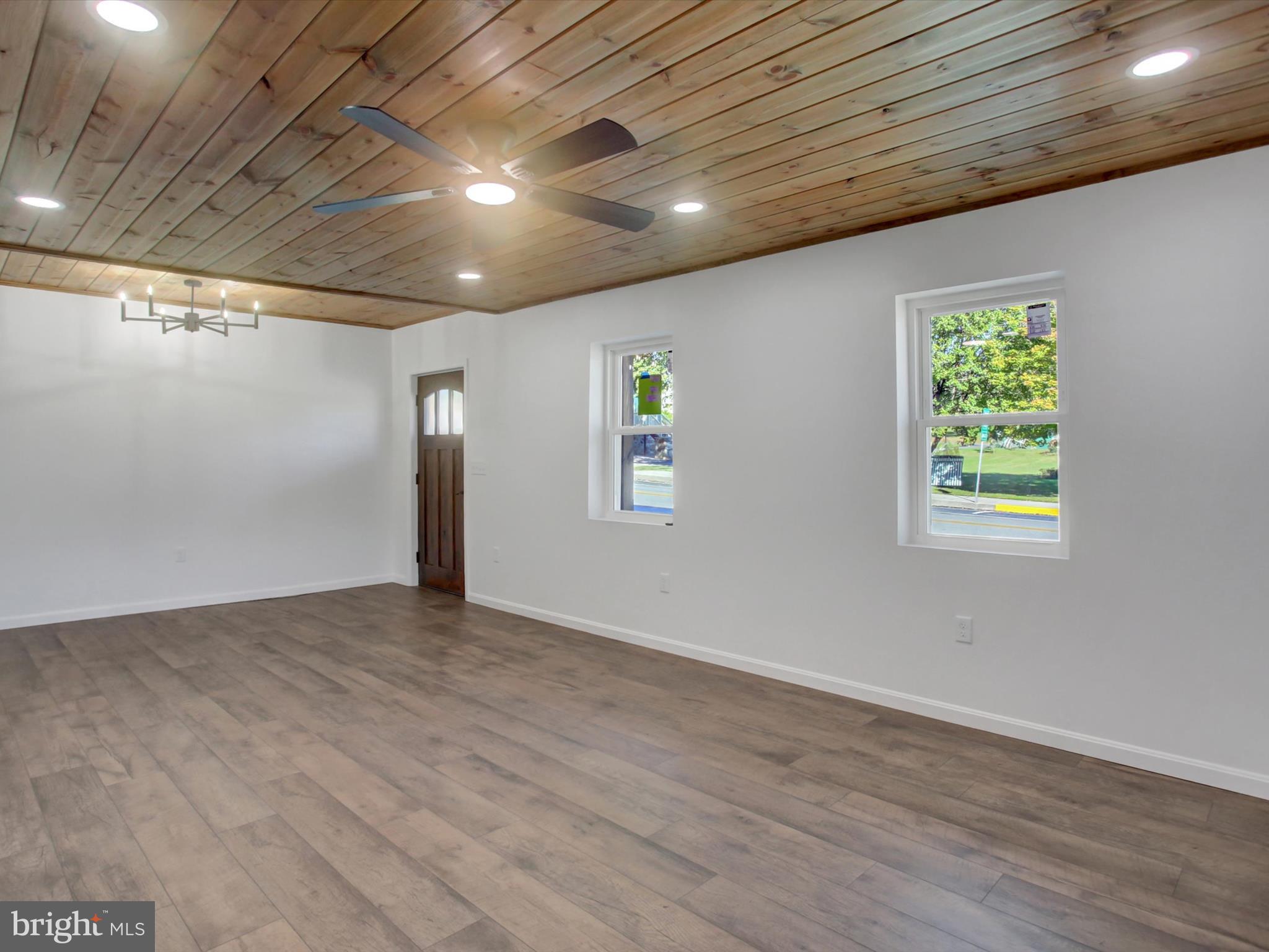 16 East Main Street Newburg, PA 17240 - Photo 8 of 48 an empty room with wooden floor and windows