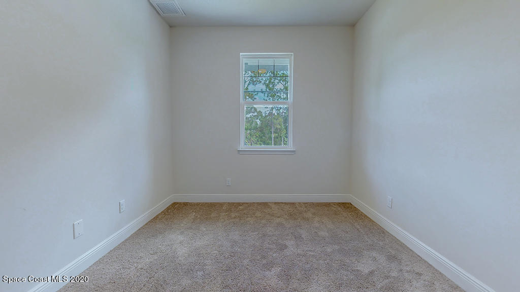 572 Corbin Circle Southwest Palm Bay, FL 32908 - Photo 20 of 32 an empty room with a window