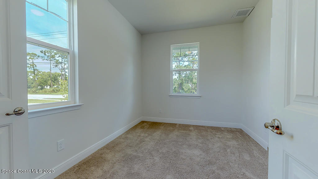 572 Corbin Circle Southwest Palm Bay, FL 32908 - Photo 23 of 32 an empty room with a window