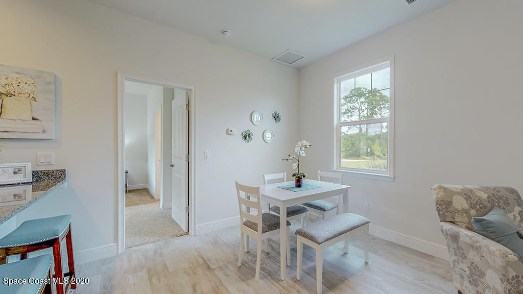 572 Corbin Circle Southwest Palm Bay, FL 32908 - Photo 28 of 32 a dining room with furniture and window