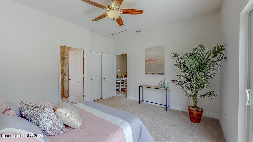 572 Corbin Circle Southwest Palm Bay, FL 32908 - Photo 10 of 32 a bedroom with bed and window