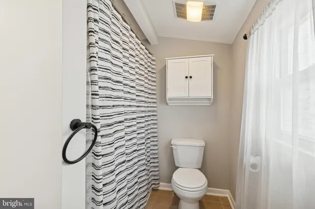 a bathroom with a toilet and a sink