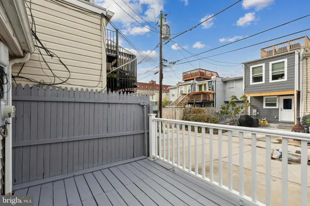 a view of a brick house with large windows