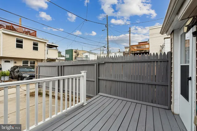 a view of a balcony with wooden floor