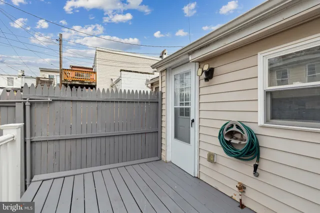 a view of a pathway of a house with wooden floor