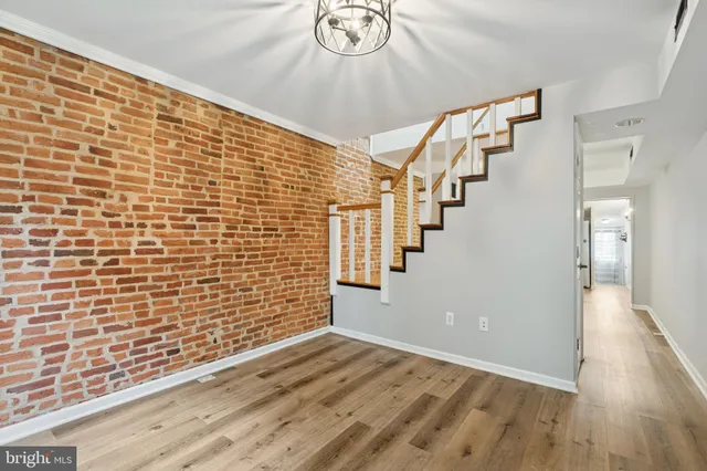 a view of an entryway with wooden floor