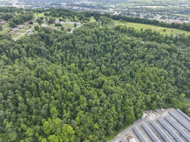 a view of a yard from a balcony