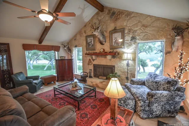 a open kitchen with stainless steel appliances kitchen island granite countertop a table and chairs
