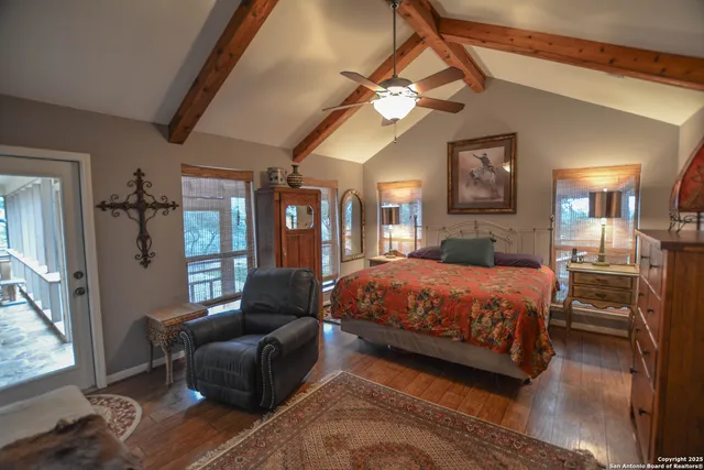 a living room with furniture with windows and outdoor view