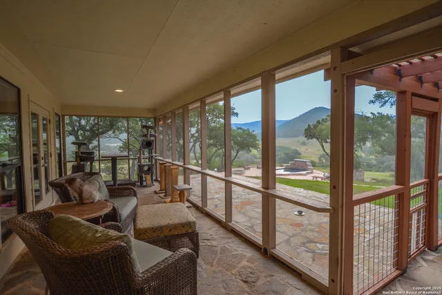 a view of a balcony with wooden floor