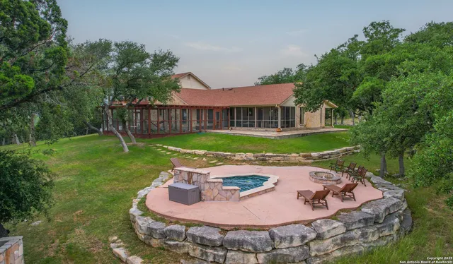 a view of a chairs and table in the patio