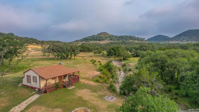 a view of a town with mountains in the background