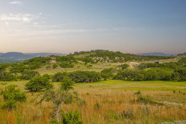 a view of a lake with mountains in the background