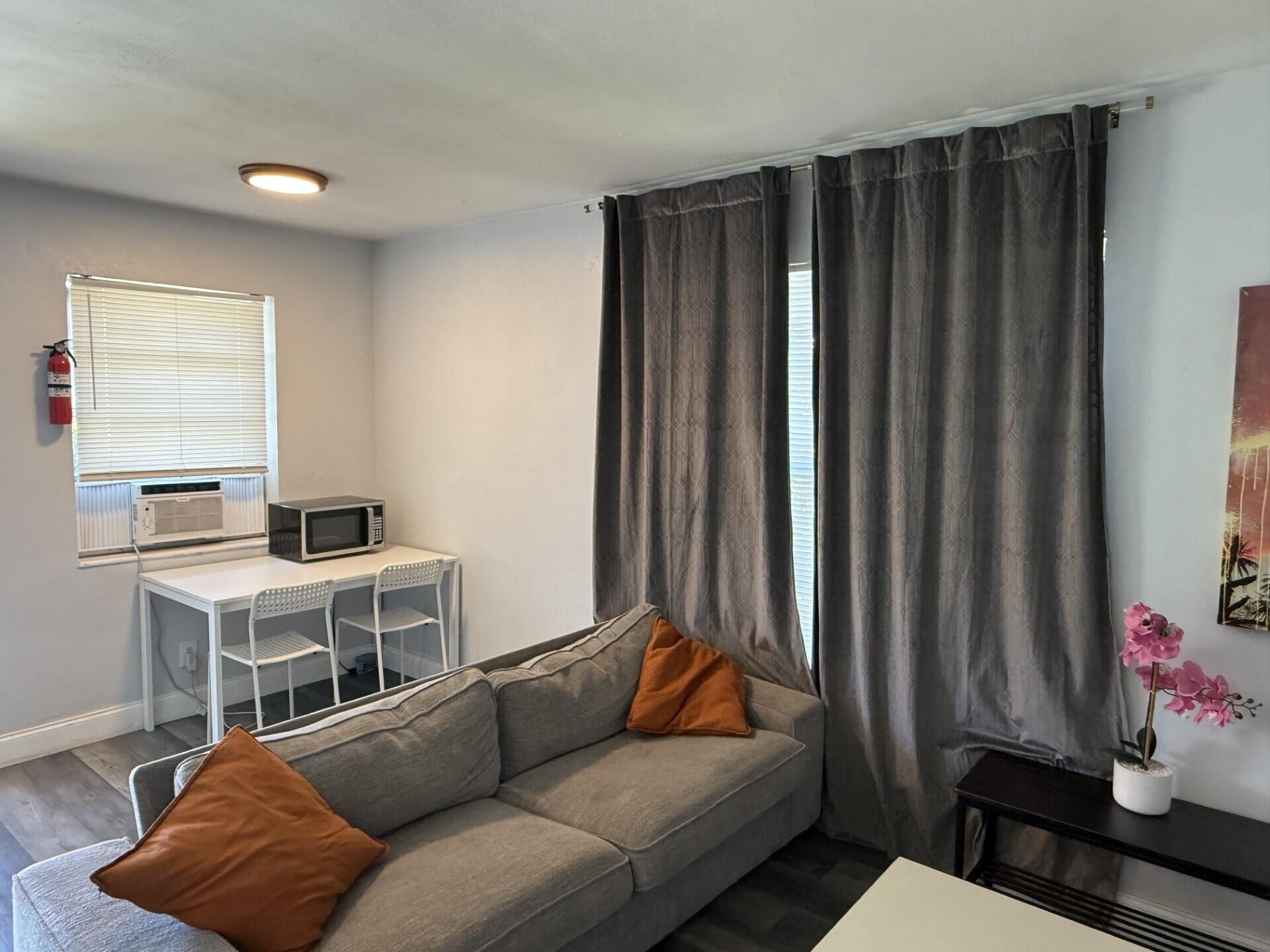 131 East 27th Street, Unit 5 Riviera Beach, FL 33404 - Photo 3 of 7 Living room from back
