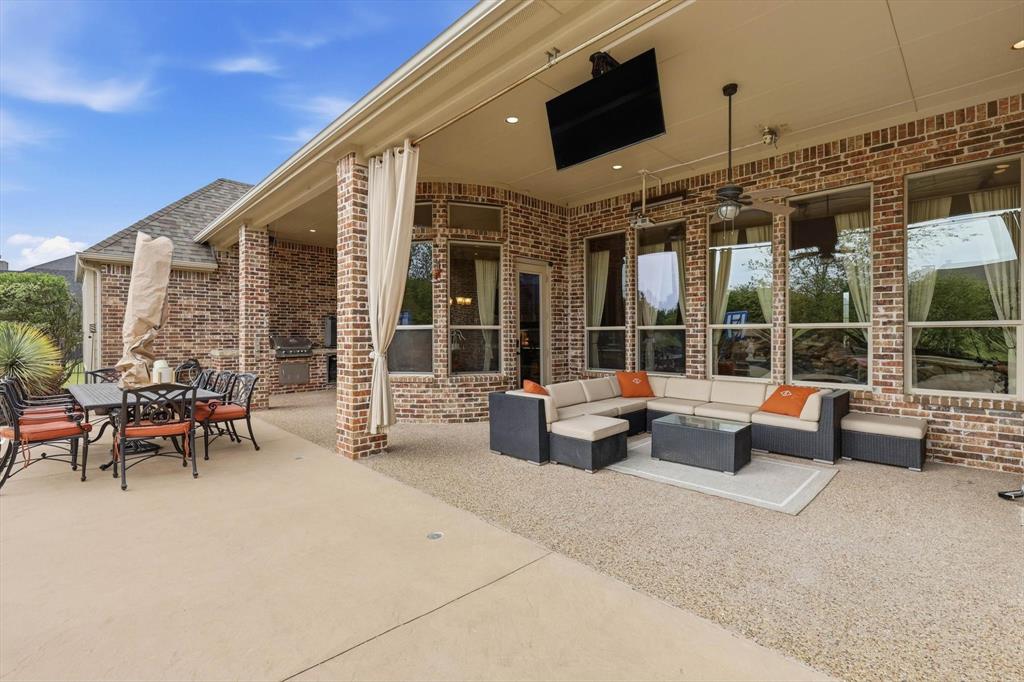 406 Spurgin Road Lucas, TX 75002 - Photo 29 of 39 View of patio / terrace with an outdoor living / dining area and a ceiling fan