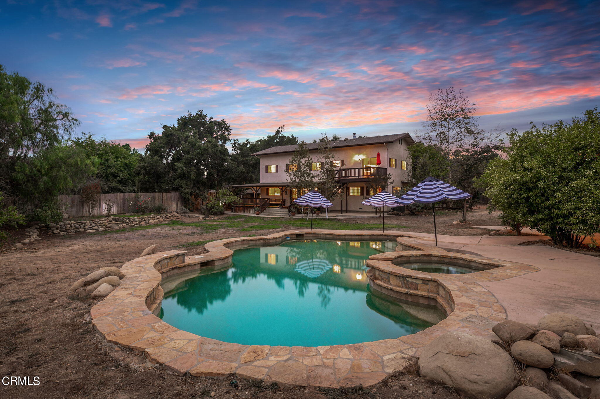 624 South Rice Road Ojai, CA 93023 - Photo 1 of 59 a swimming pool with outdoor seating and plants