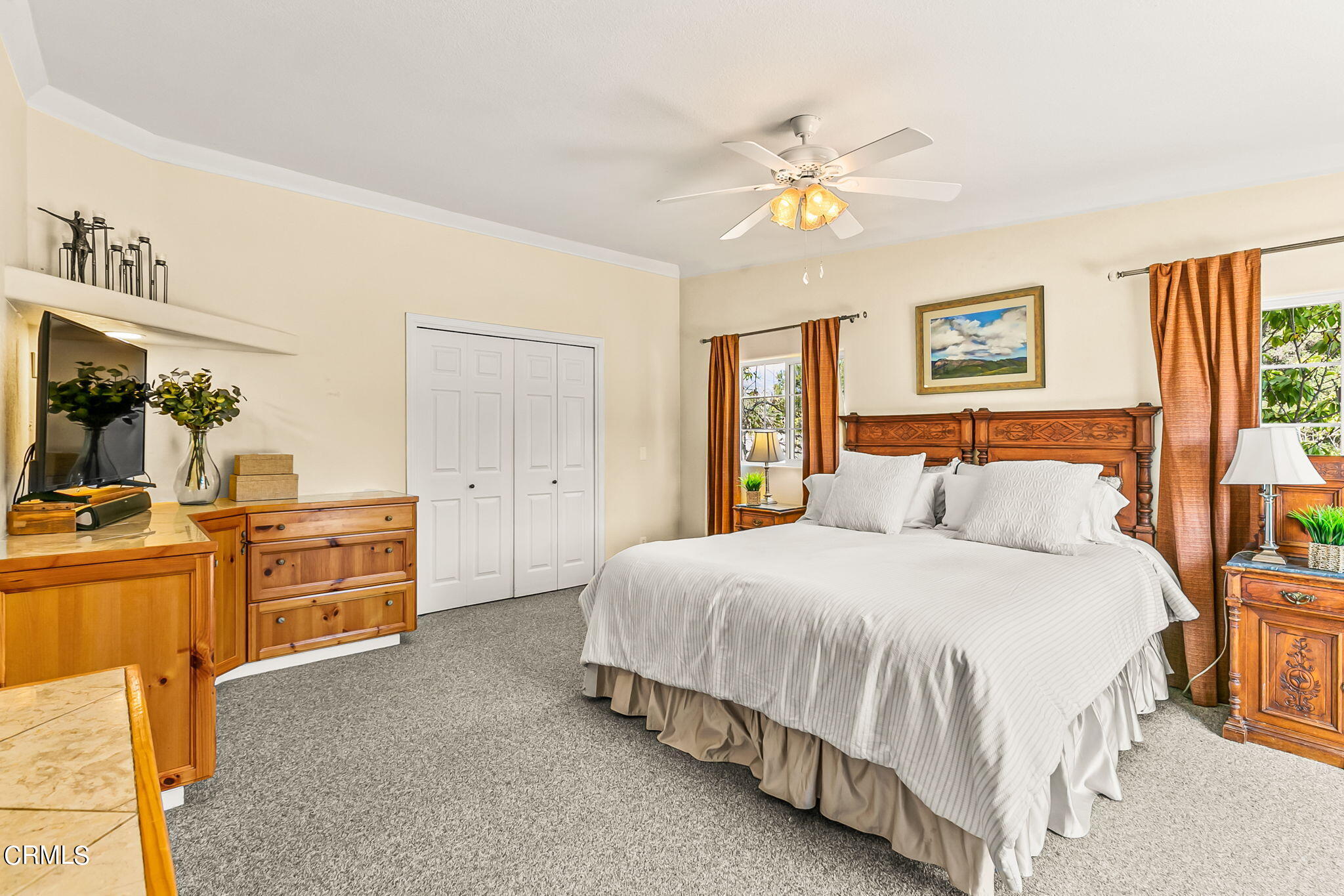 624 South Rice Road Ojai, CA 93023 - Photo 23 of 59 a bedroom with a bed and dresser with mirror