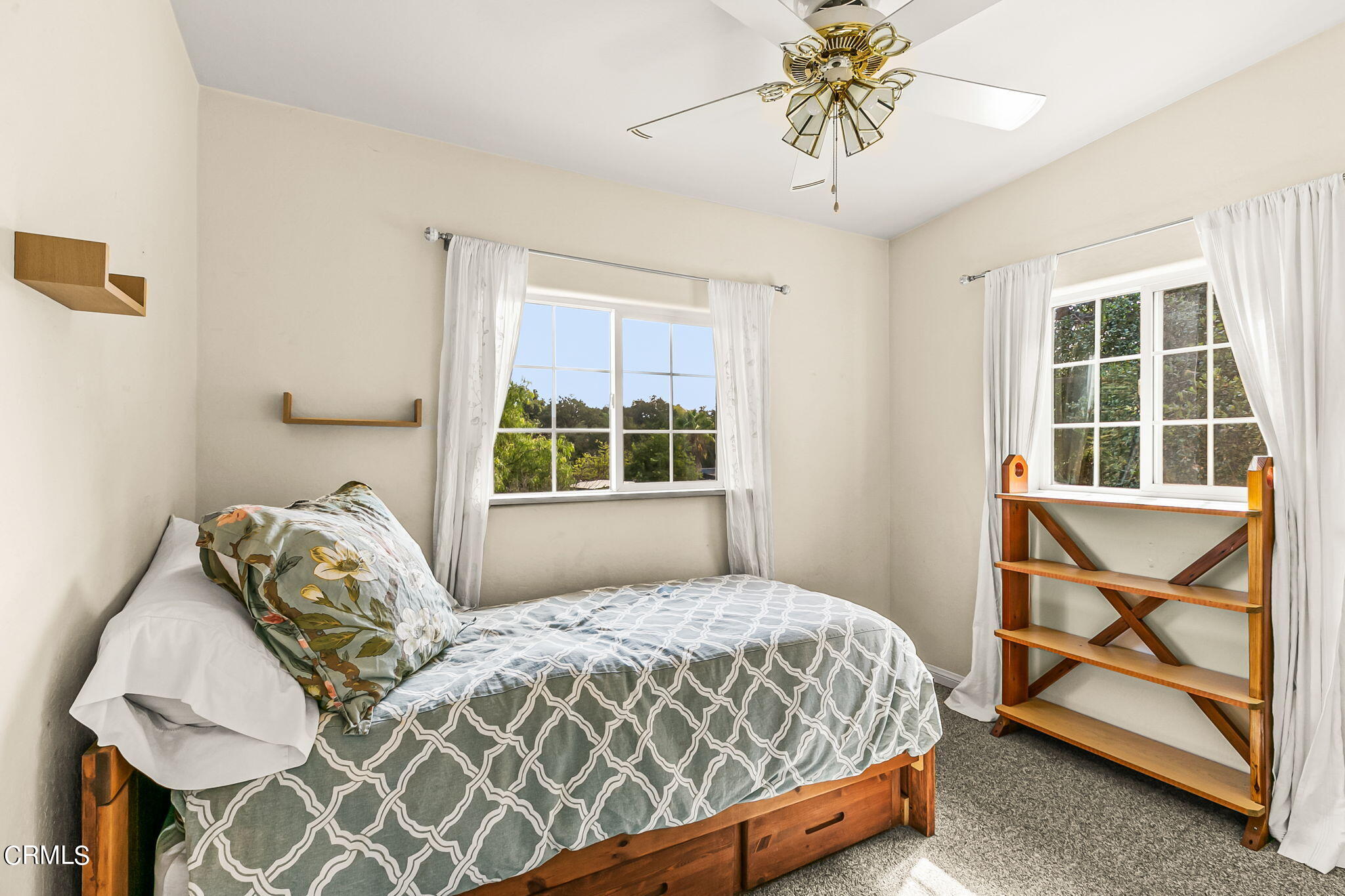 624 South Rice Road Ojai, CA 93023 - Photo 27 of 59 a bedroom with a bed and a window