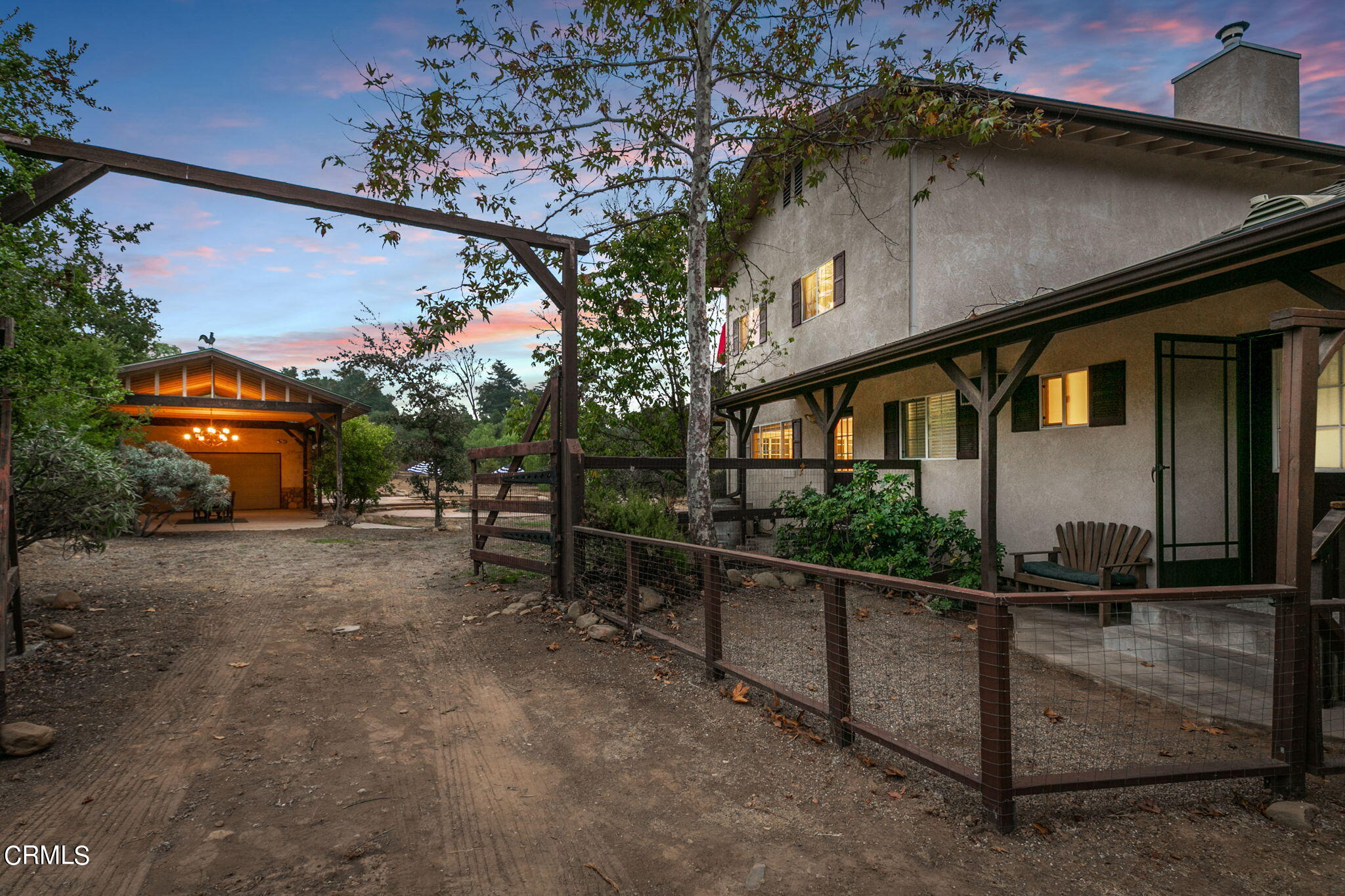 624 South Rice Road Ojai, CA 93023 - Photo 3 of 59 a front view of a house with wooden fence
