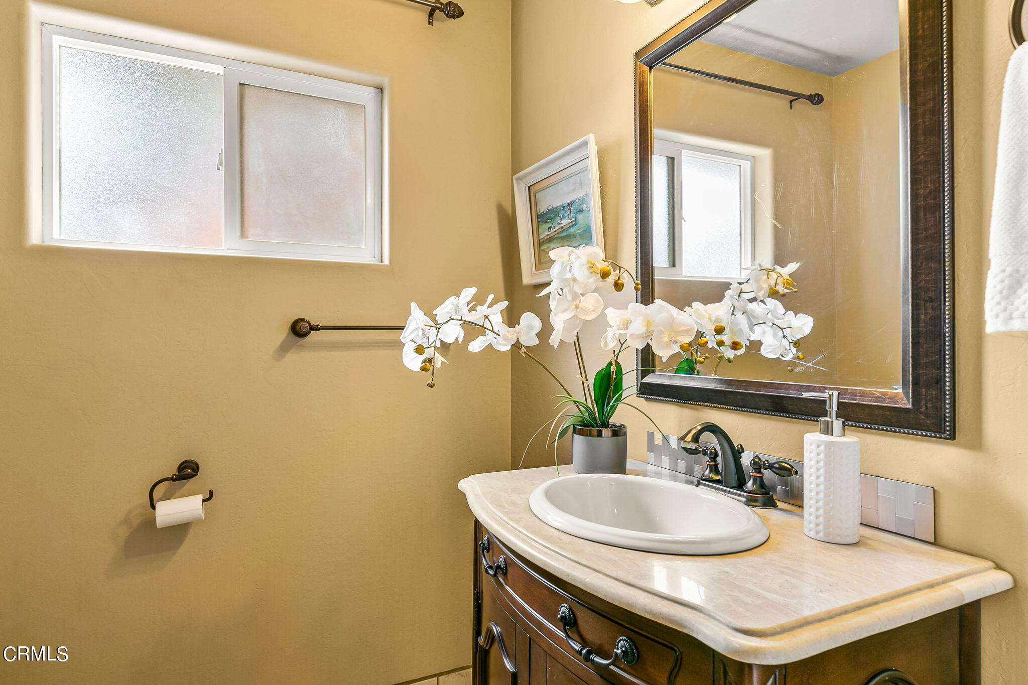 624 South Rice Road Ojai, CA 93023 - Photo 33 of 59 a bathroom with a sink and a mirror