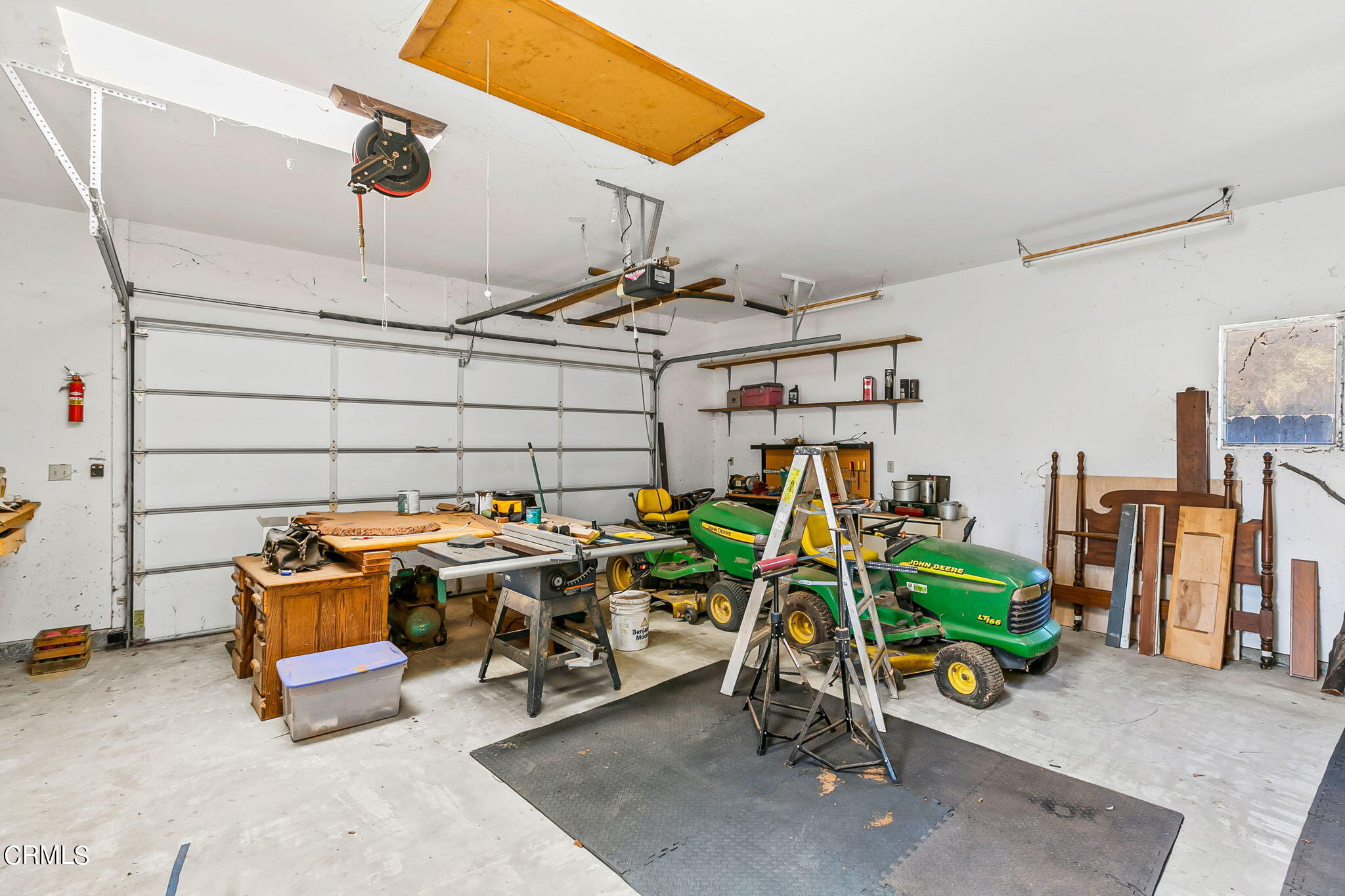 624 South Rice Road Ojai, CA 93023 - Photo 40 of 59 a view of a garage with a table and chairs