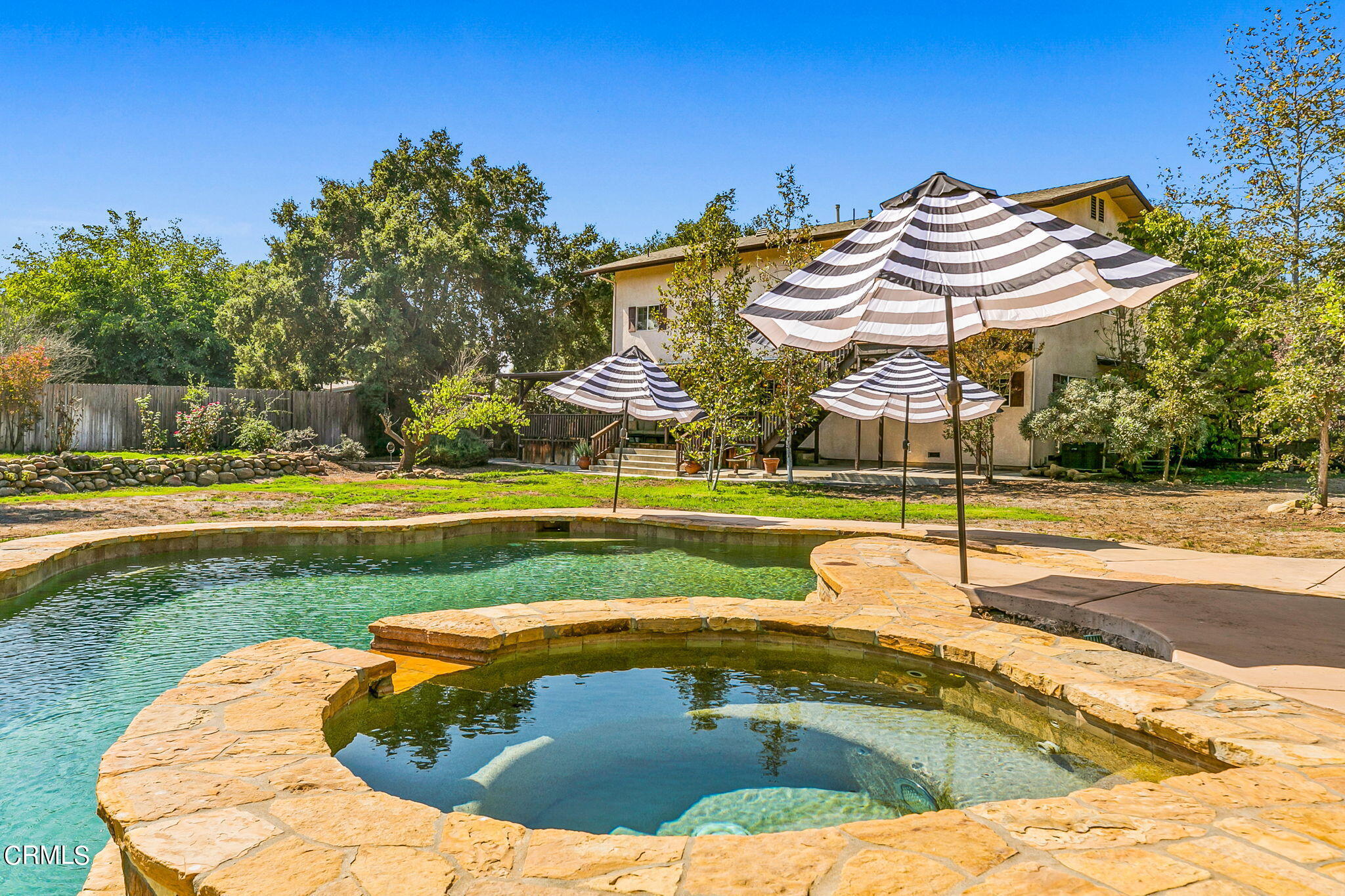 624 South Rice Road Ojai, CA 93023 - Photo 46 of 59 a view of a swimming pool with a bench and floor