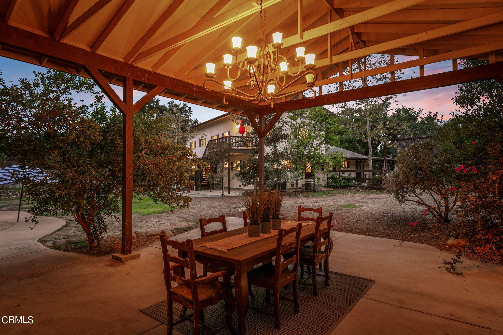 624 South Rice Road Ojai, CA 93023 - Photo 5 of 59 a view of a patio with table and chairs with wooden floor and fence