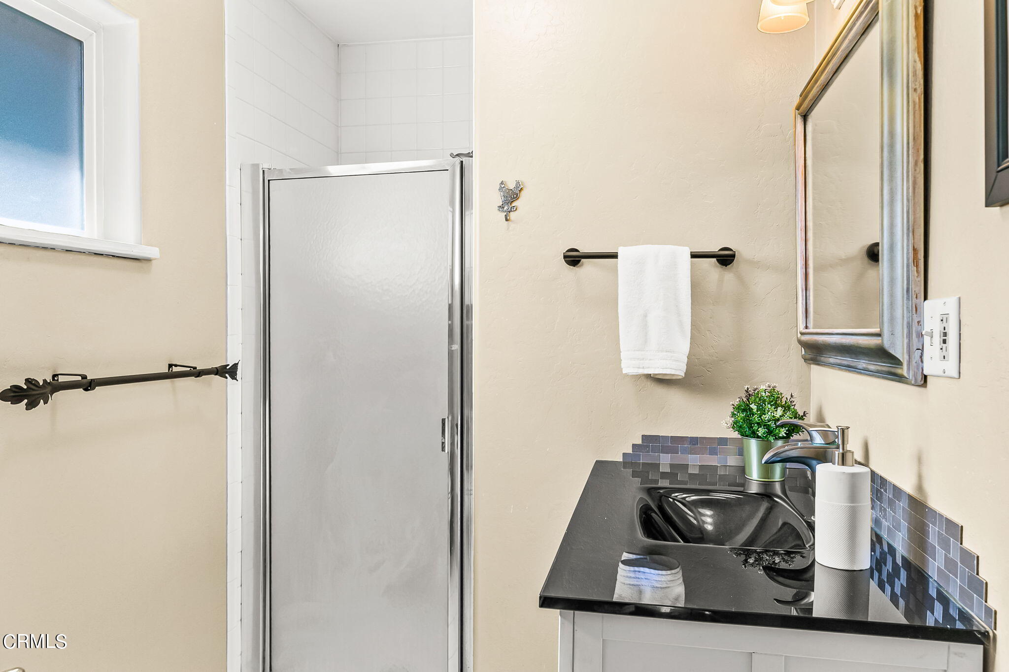 624 South Rice Road Ojai, CA 93023 - Photo 53 of 59 a bathroom with a granite countertop sink a mirror and shower