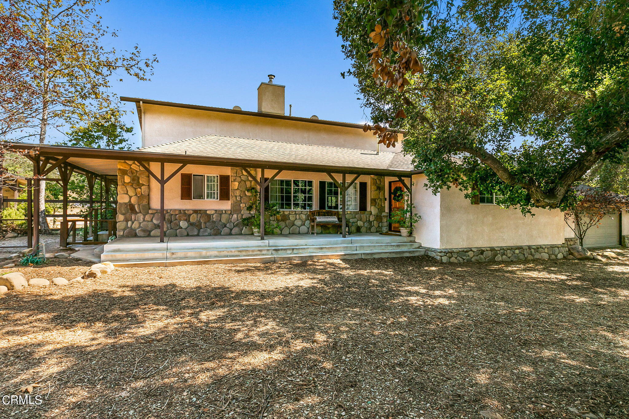 624 South Rice Road Ojai, CA 93023 - Photo 6 of 59 a front view of a house with a garden