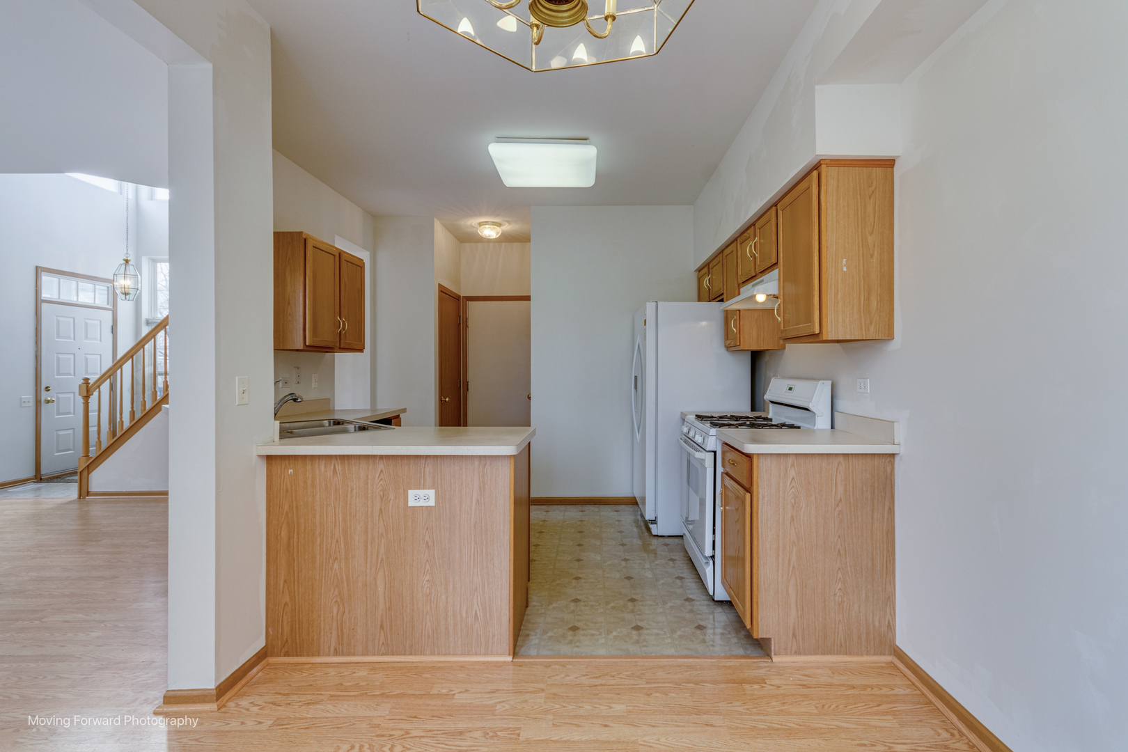 1086 Delta Drive Elgin, IL 60123 - Photo 11 of 29 a kitchen with a sink appliances and cabinets