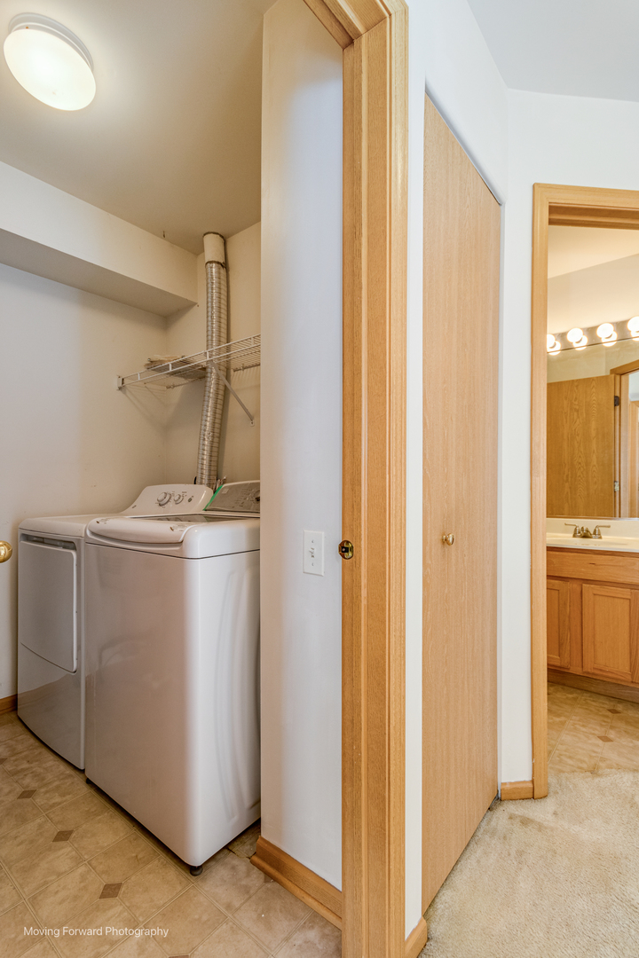 1086 Delta Drive Elgin, IL 60123 - Photo 17 of 29 a utility room with closet dryer and washer