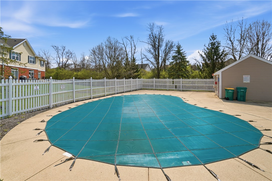 4294 Straight Arrow Road Dayton, OH 45430 - Photo 40 of 41 This private pool area, enclosed by a classic picket fence, promises relaxation and outdoor enjoyment.