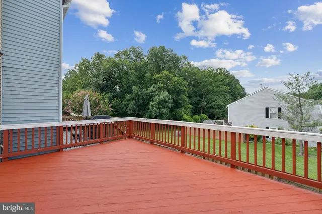 a view of a balcony with wooden floor