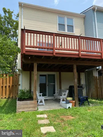 a view of a house with a yard porch and sitting area