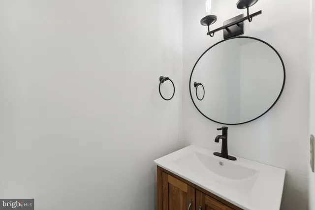 a bathroom with a sink and mirror