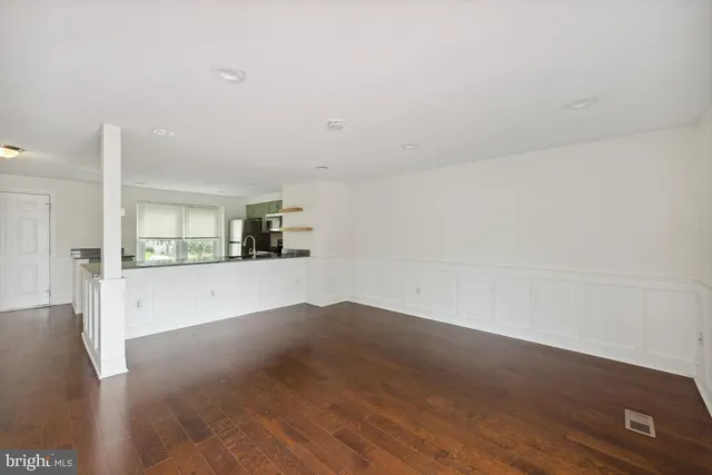 a view of kitchen and wooden floor