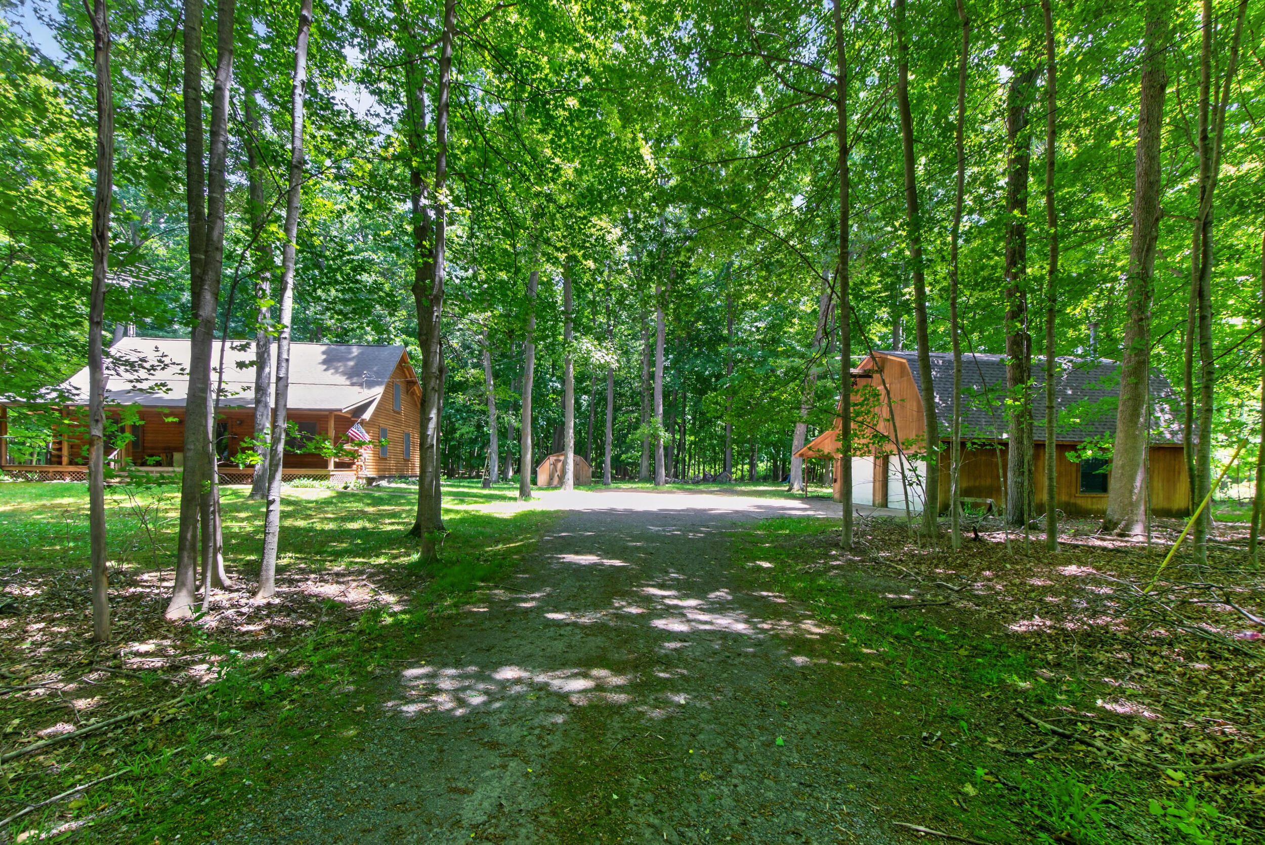 7789 Thorne Road Horton, MI 49246 - Photo 63 of 65 Driveway View of Home and Garage