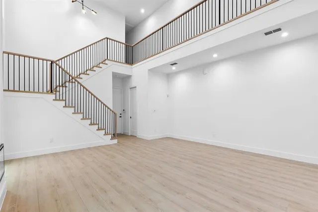 a view of an entryway with wooden floor