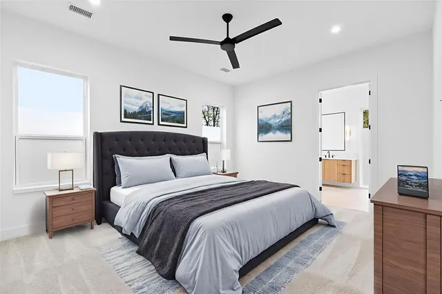 a bedroom with a bed couch and window