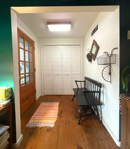 a view of a room with gym equipment and windows