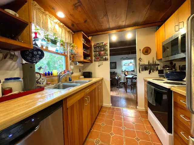 a kitchen with stainless steel appliances lots of counter top space