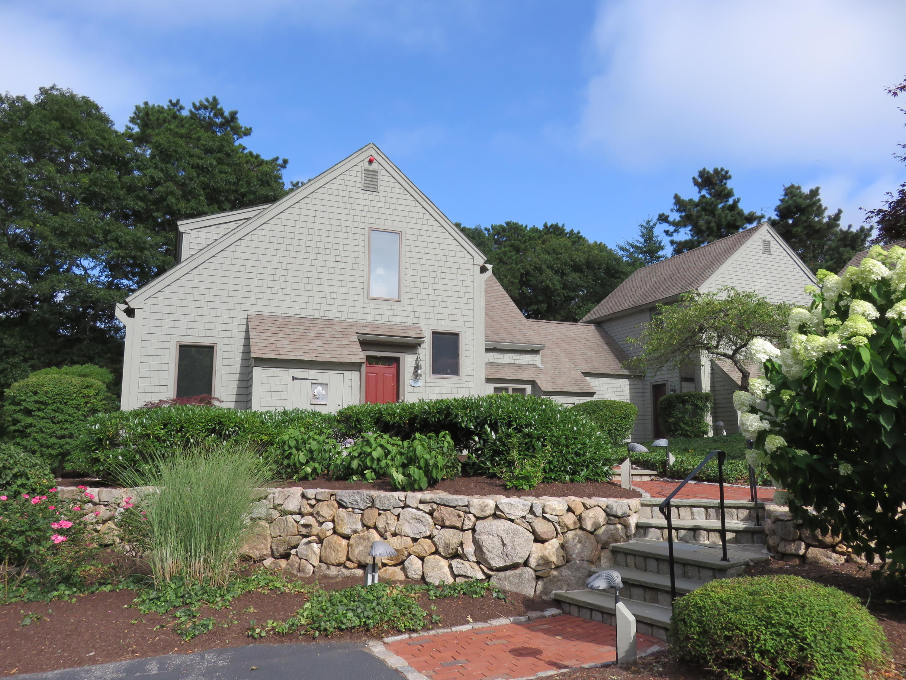 22 Mid-Iron Way, Unit 7509 Mashpee, MA 02649 - Photo 1 of 32 a view of a house with a yard