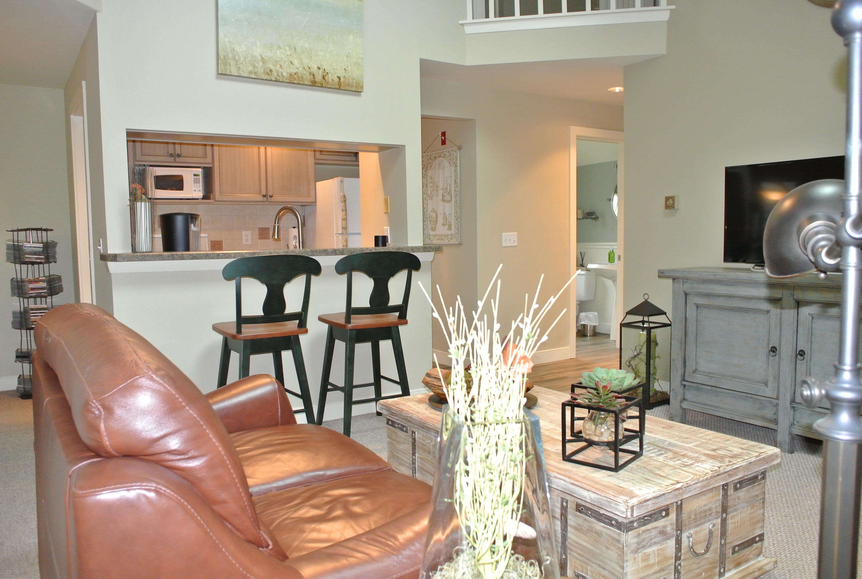 22 Mid-Iron Way, Unit 7509 Mashpee, MA 02649 - Photo 11 of 32 a living room with furniture and wooden floor