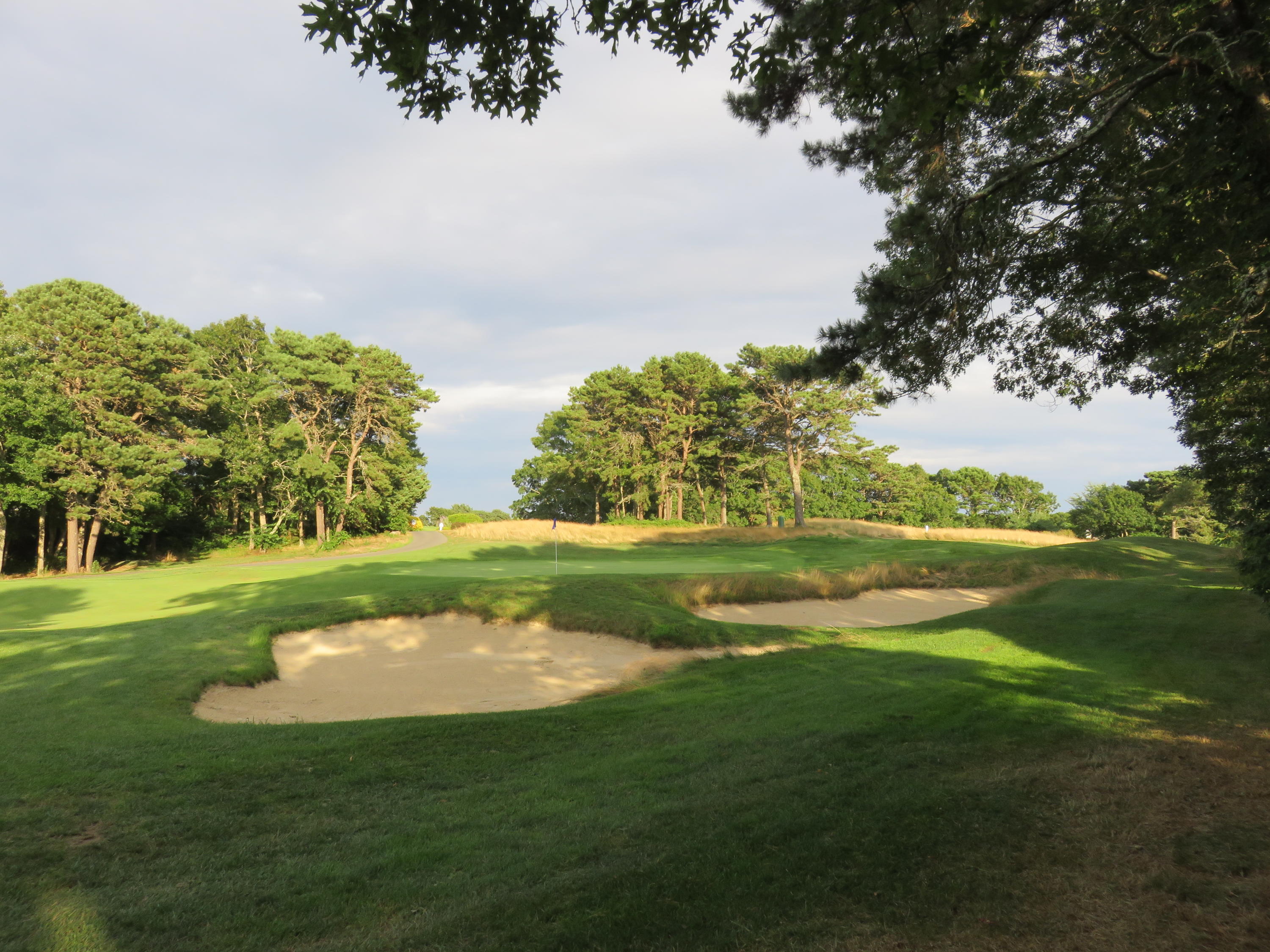 22 Mid-Iron Way, Unit 7509 Mashpee, MA 02649 - Photo 2 of 32 a view of a golf course with a lake