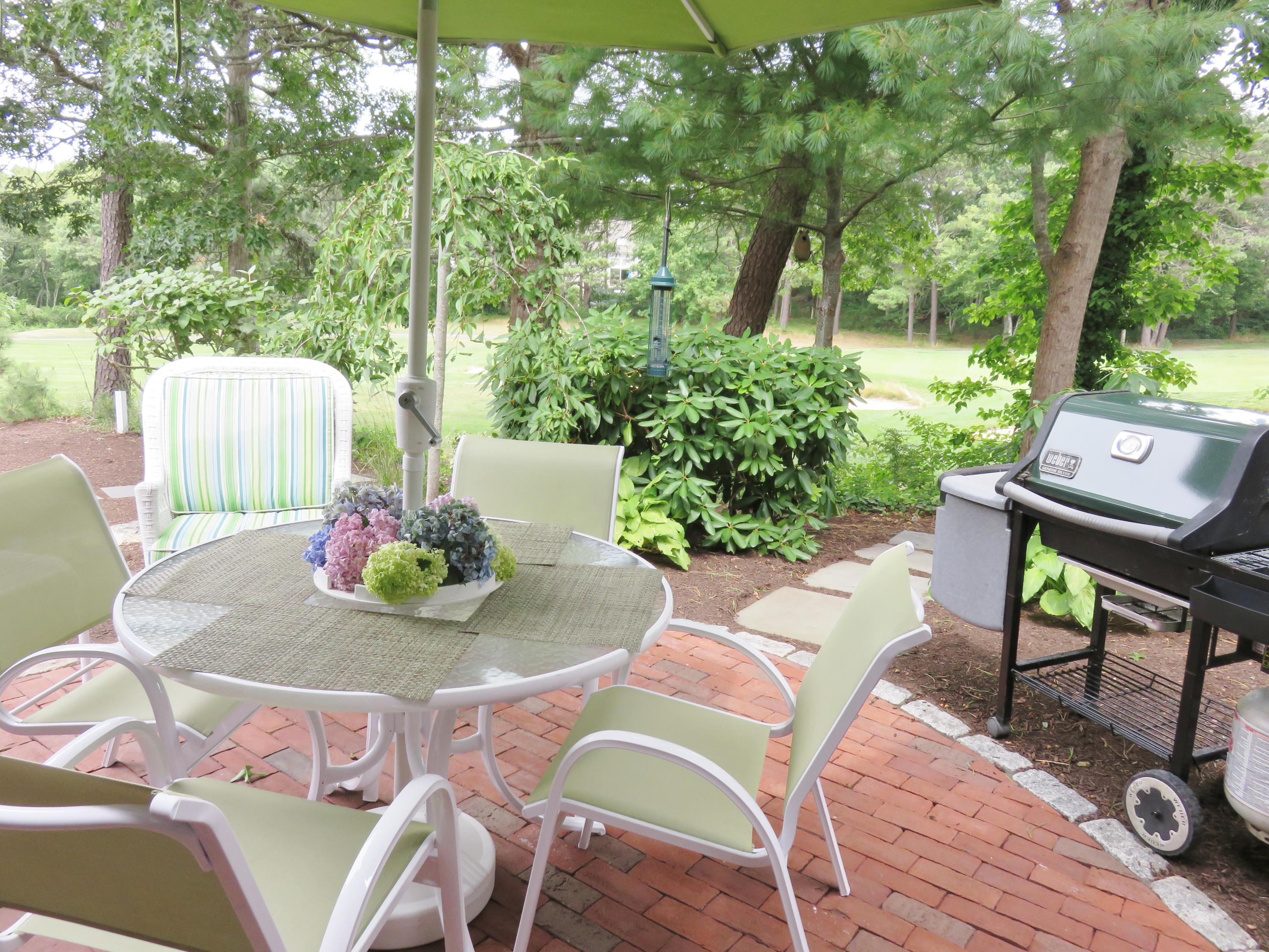 22 Mid-Iron Way, Unit 7509 Mashpee, MA 02649 - Photo 4 of 32 a outdoor space with furniture