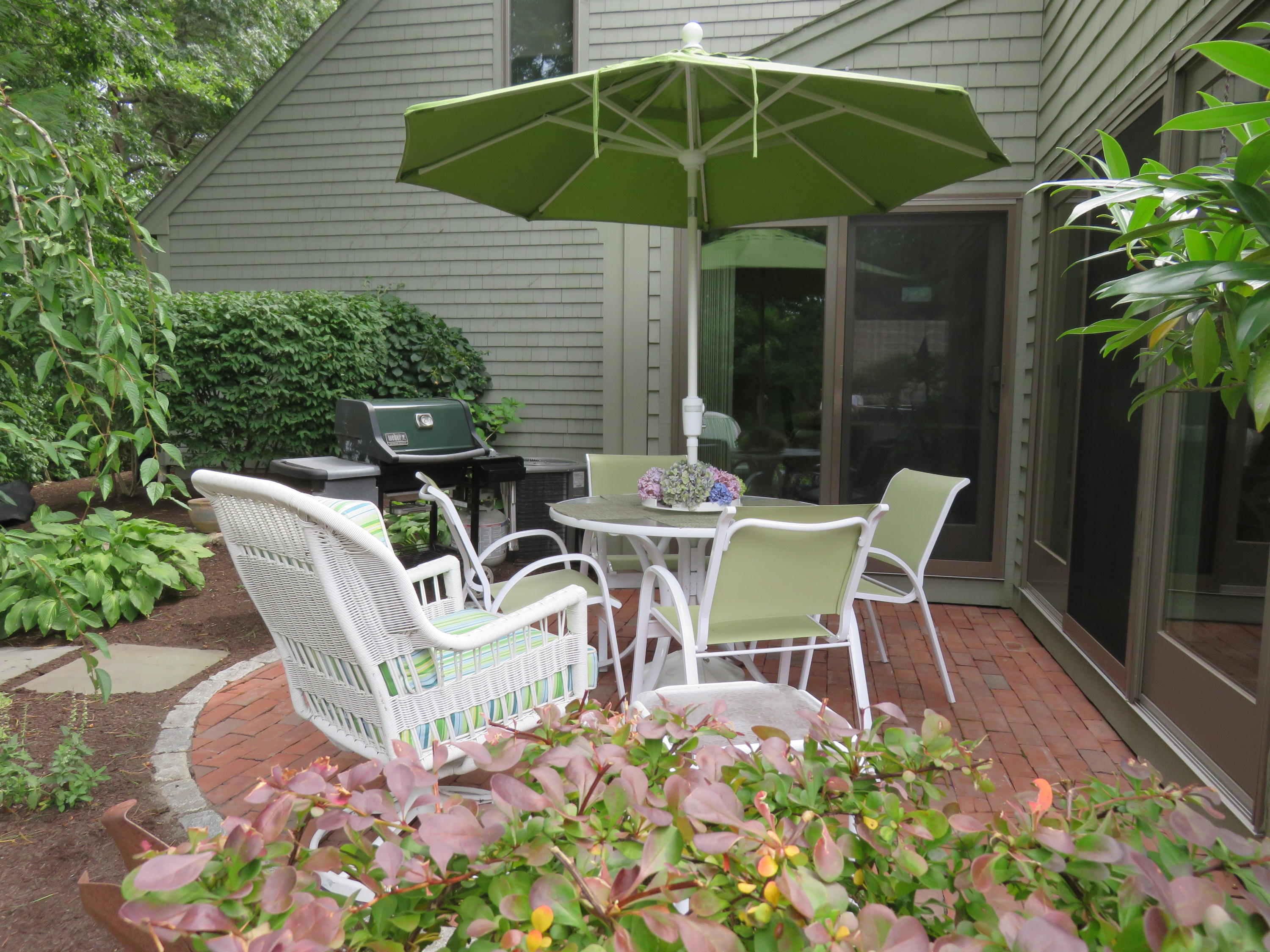 22 Mid-Iron Way, Unit 7509 Mashpee, MA 02649 - Photo 5 of 32 a view of backyard of house with seating space